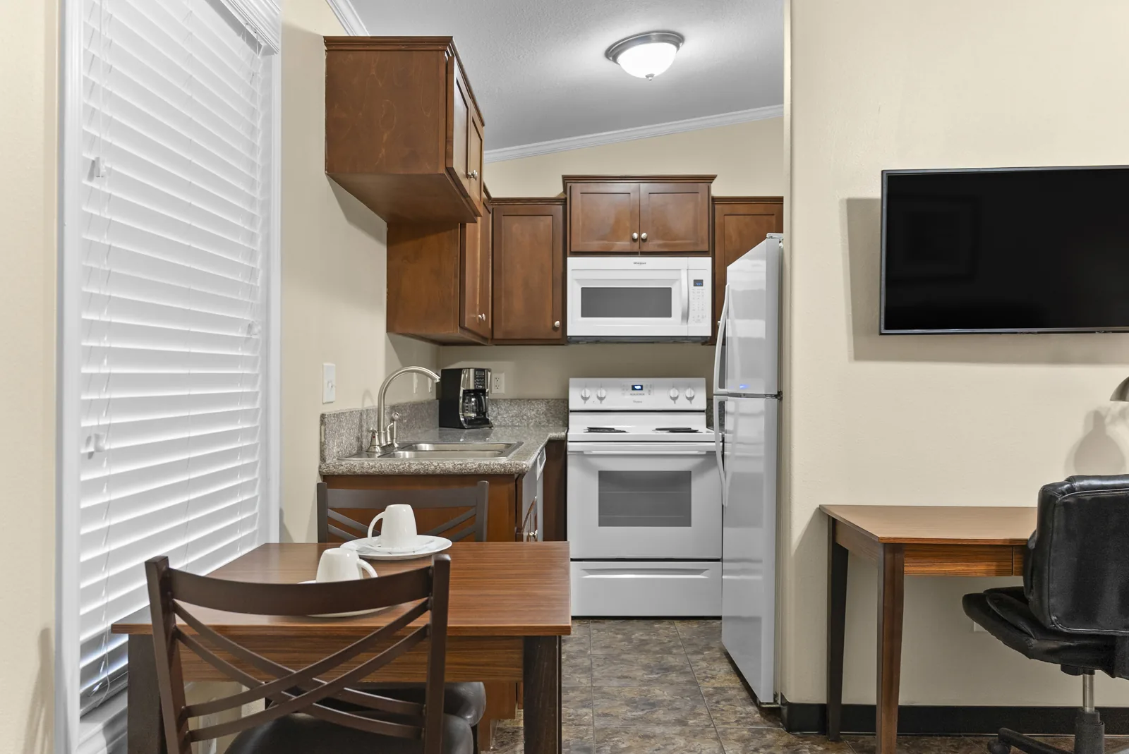 Bayou kitchen, dining table and desk from the door