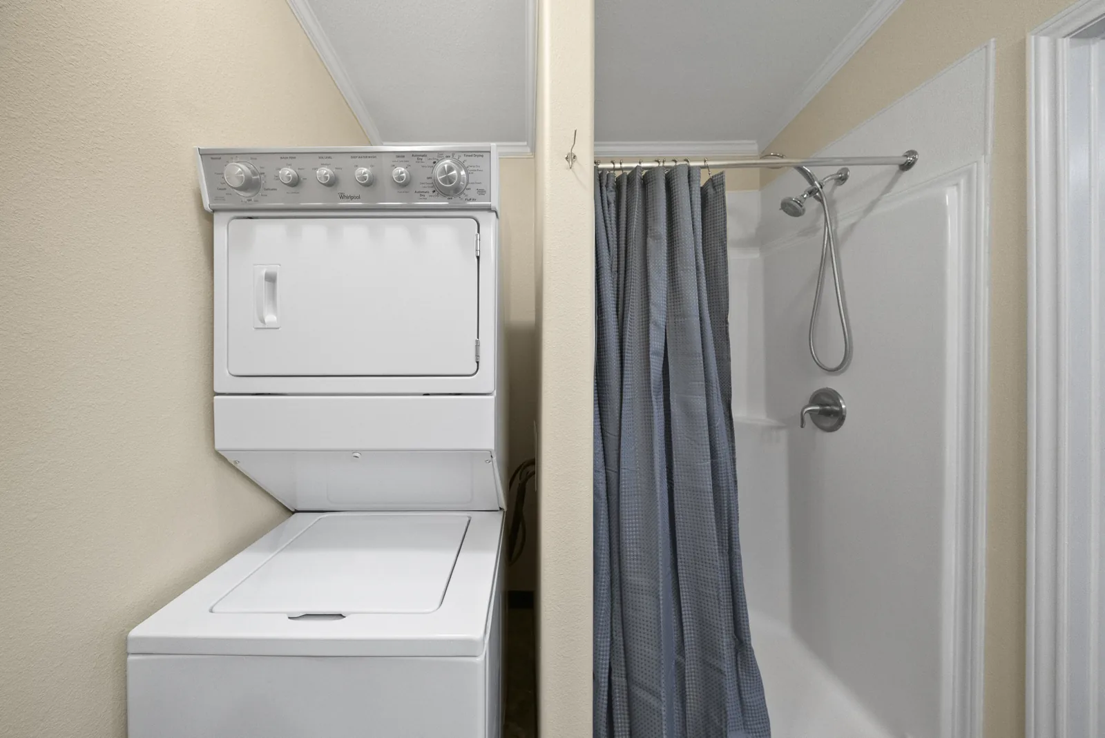 Bayou full-size stacked washer and dryer and walk-in shower