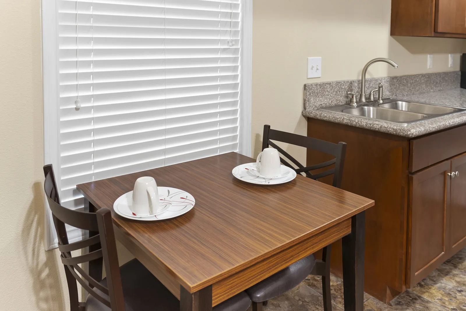 Bayou dining table for two by the window