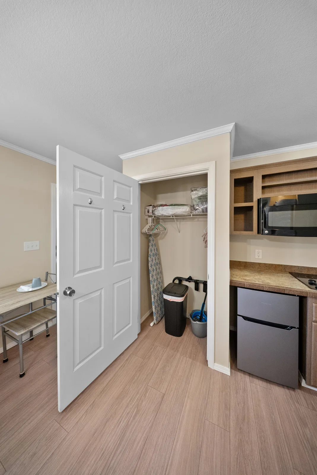 Cypress closet with hangers and iron